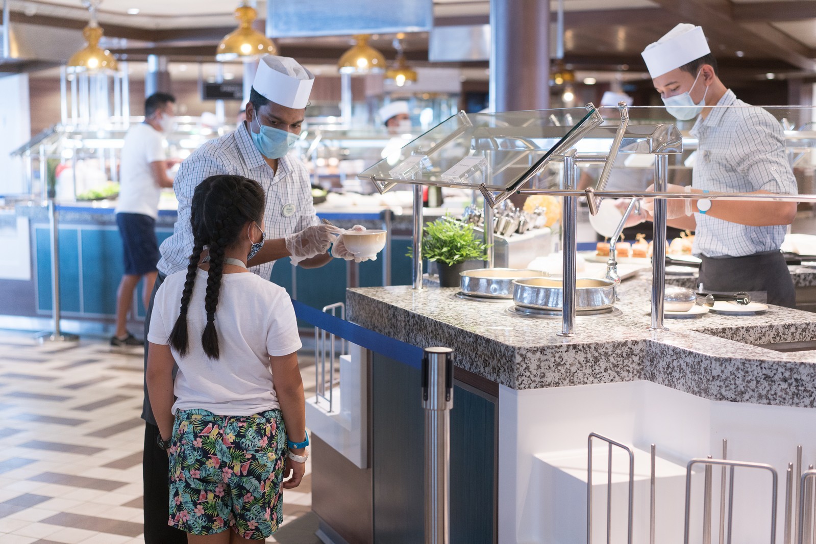 At Windjammer Marketplace, previously a self-service experience, dedicated crew now serve guests and offer a greater variety of grab-and-go items.