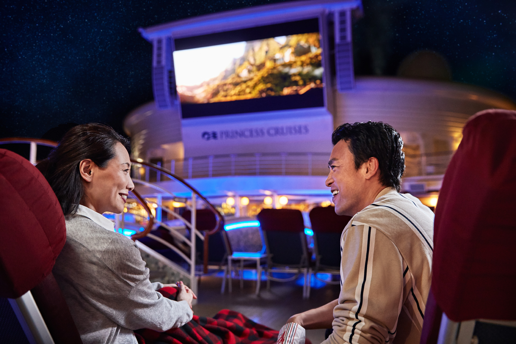 Couple watching Movies Under the Stars MUTS on Princess cruise ship (source: Princess Cruises)