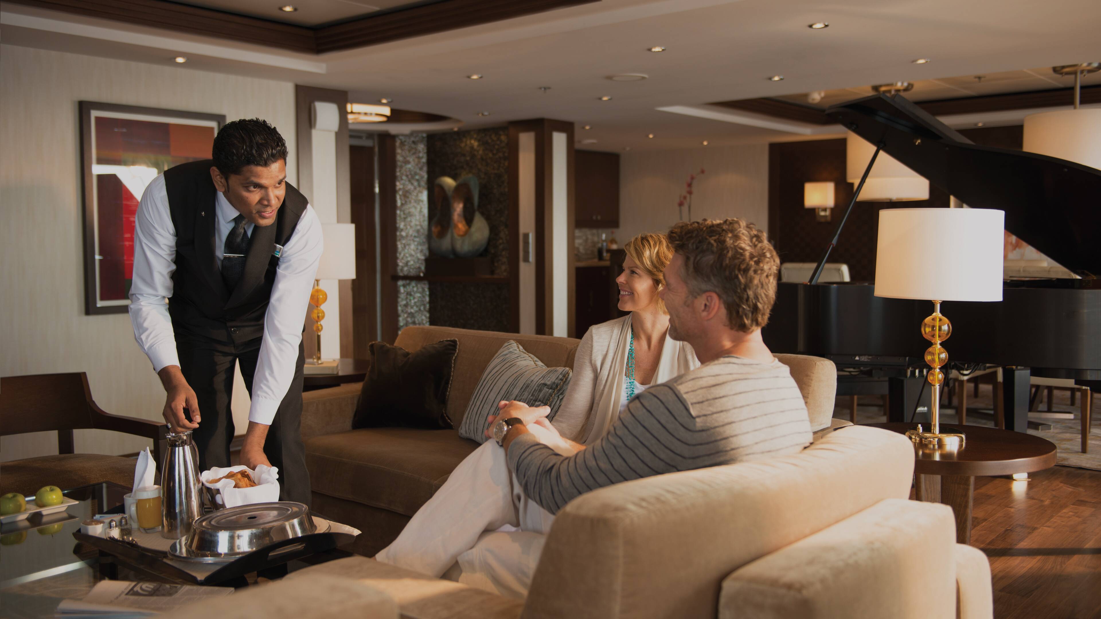 Couple ordering room service in suite