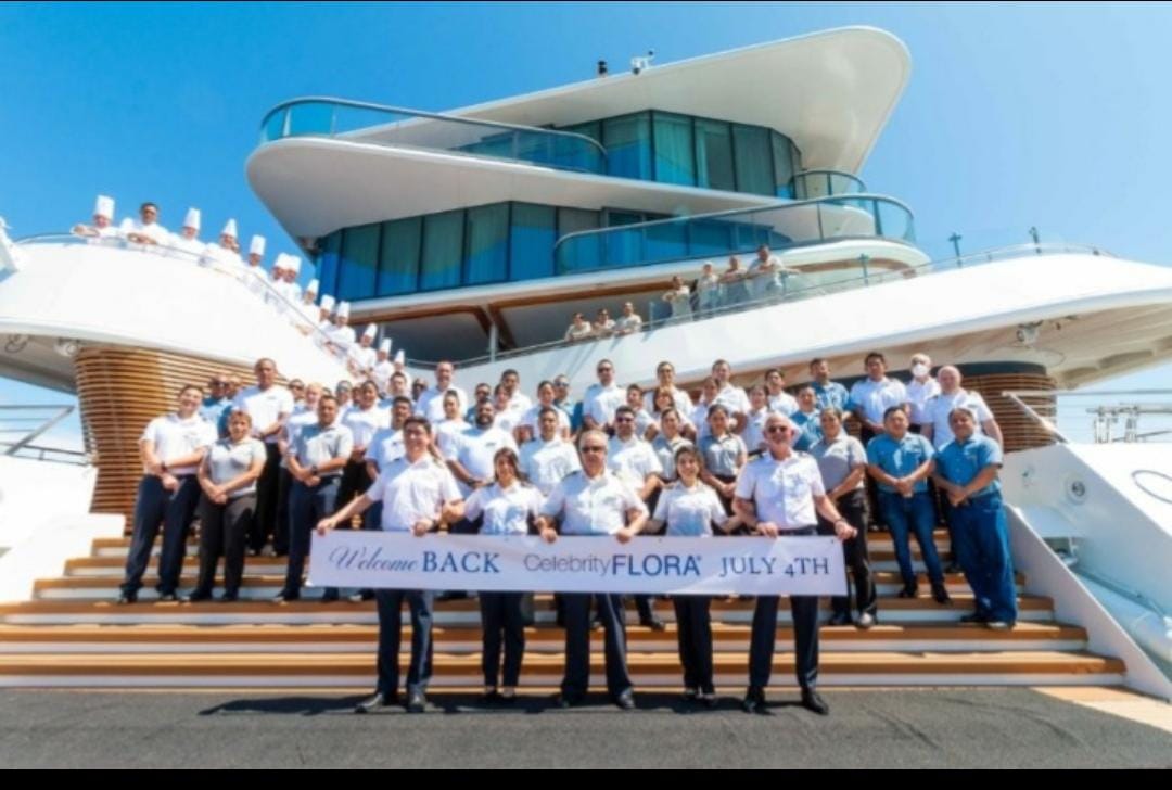 Crew welcoming back guests on Celebrity Flora