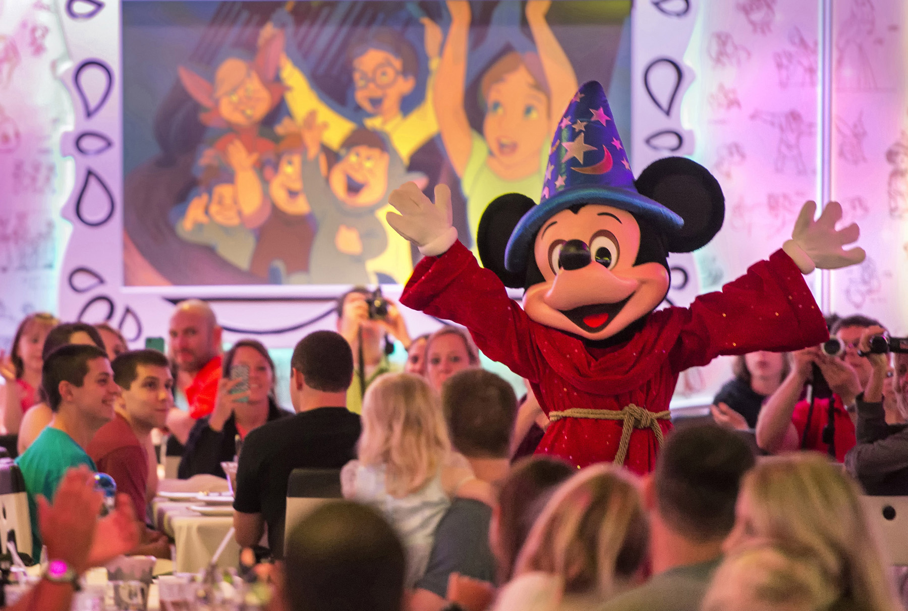 Sorcerer Mickey greets passengers dining at Animator's Palate on a Disney Cruise Line ship (source: Disney Cruise Line)