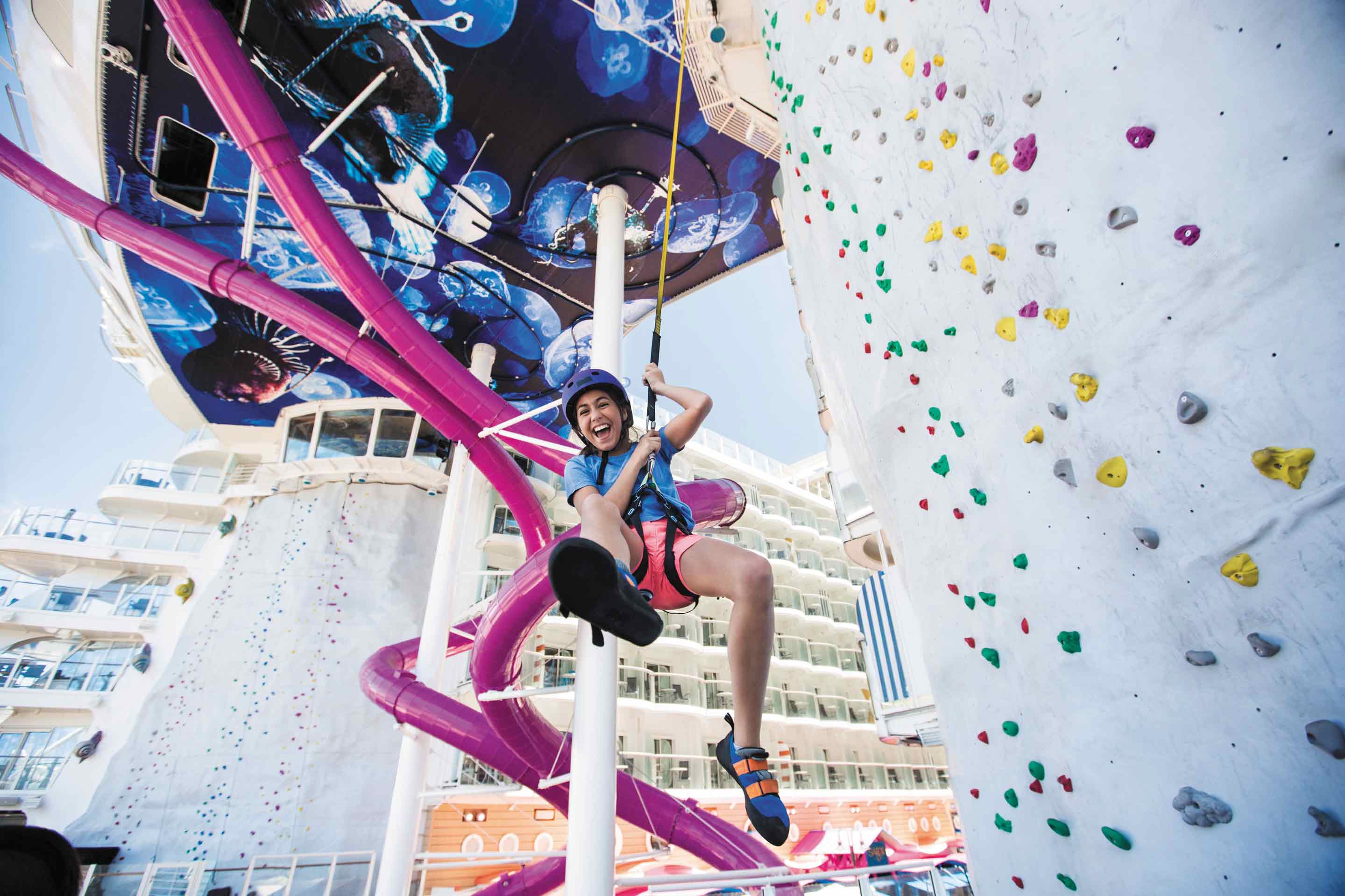 Girl on rock climbing wall of Harmony of the Seas