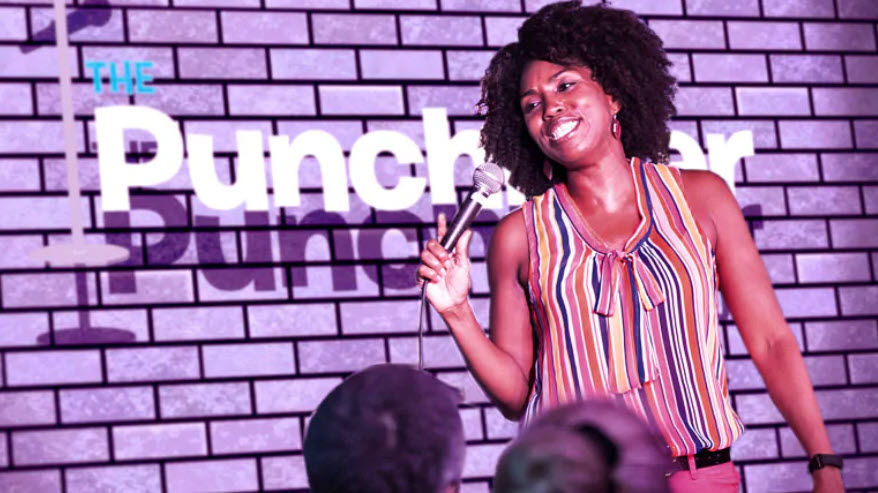 A comedian performs in Carnival's Punchliner comedy club (source: Carnival Cruise Line)
