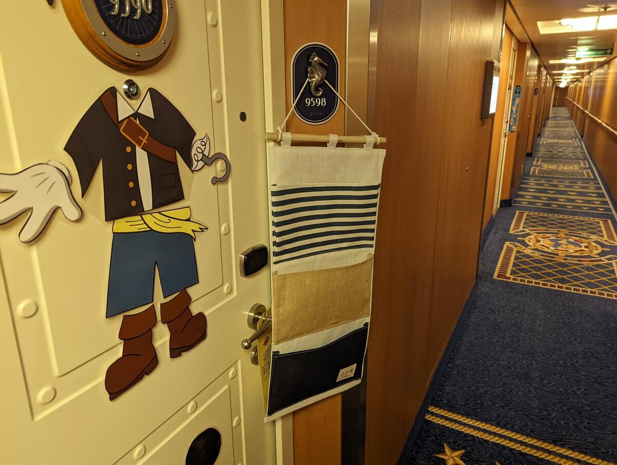 Fish Extender participants leave surprise gifts in personalized hangers  outside the stateroom. 20 Things to Know Before Taking a Disney Cruise. -  Globetrotting Mommy