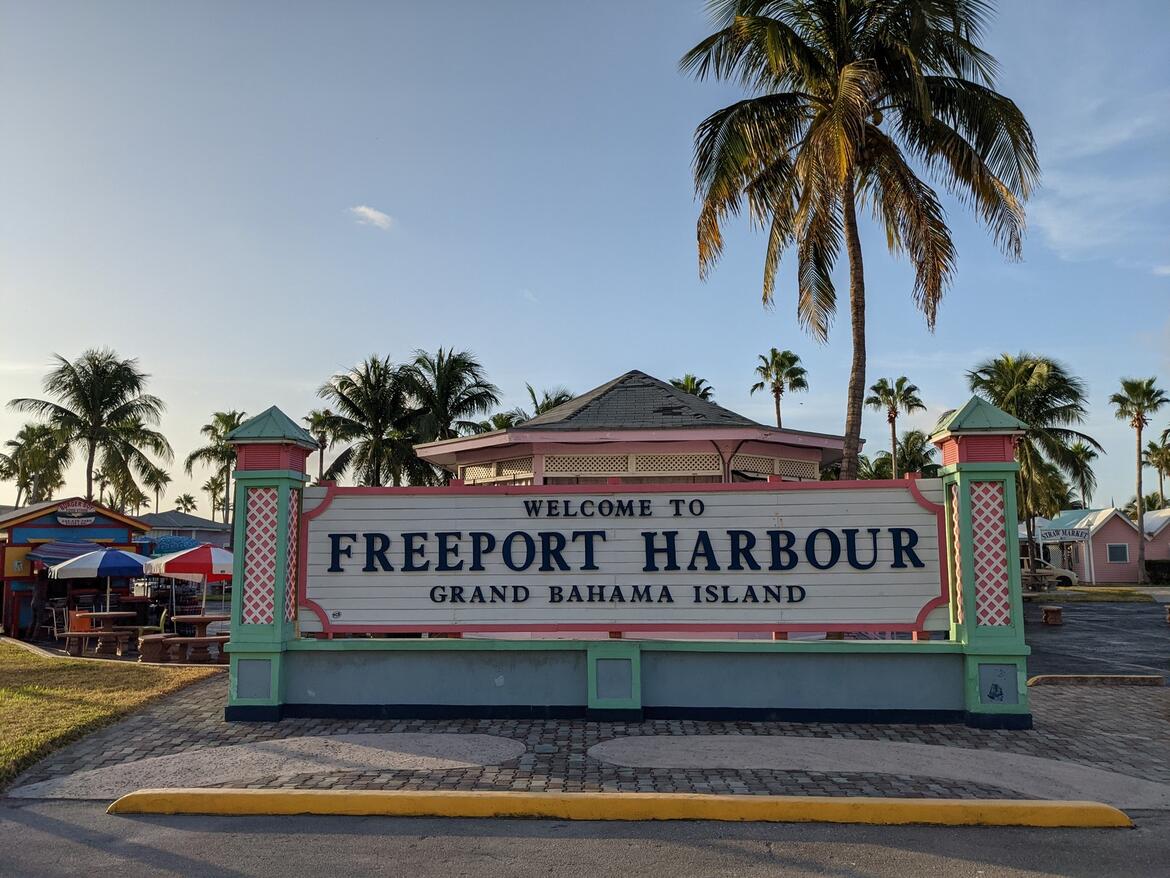 Welcome to Freeport Bahamas sign with palm tree