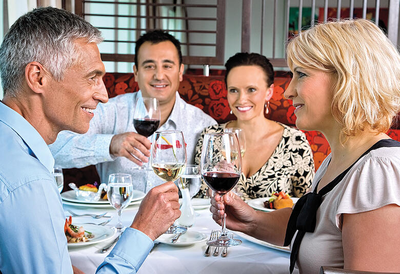 Adults enjoying dinner