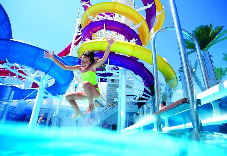 Kid jumping in pool on NCL cruise ship