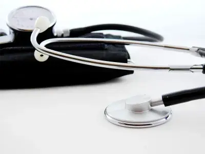 Black stethoscope on a white table (source: Bru-nO, Pixabay)