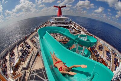Woman sliding down waterslide Carnival cruise ship