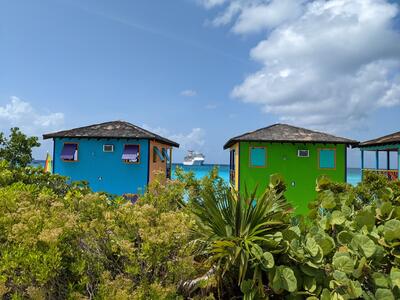 Carnival Pride between two Half Moon Cay cabanas