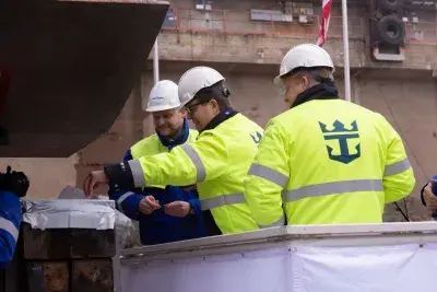 Icon of the Seas coins being placed