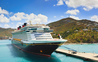 Cruise ship Disney Fantasy docked at St Thomas on sunny day.