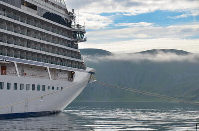 Cruise ship with early moutnain fog