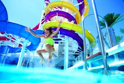 Kid jumping in pool on NCL cruise ship