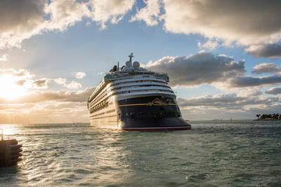 Disney ship with sunset