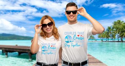 couple wearing a matching cruise t-shirt while on the beach