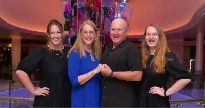Family of four pose during their Royal Caribbean cruise