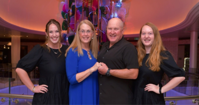 Family of four pose during their Royal Caribbean cruise