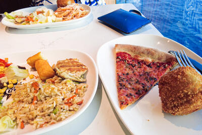 Three plates of food at a buffet