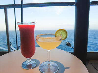 two cocktails with an ocean view