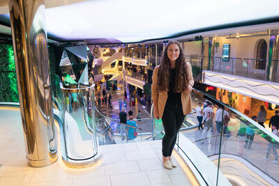 girl posing near staircase