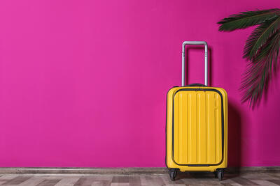 yellow-suitcase-stock