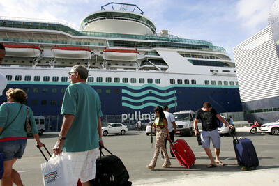 Cruise ship docked and boarding passengers 