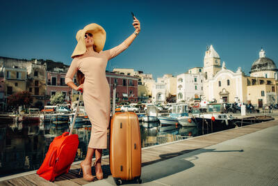 smiling woman with suitcases
