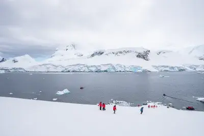 people hiking in Antarctica