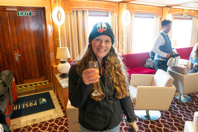 Girl smiling holding a glass of champagne