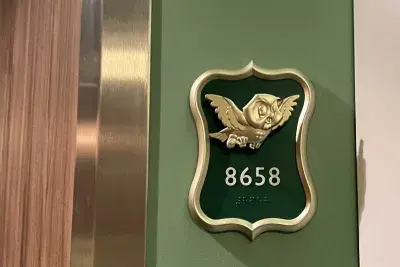 Owl "fish" on stateroom number plaque