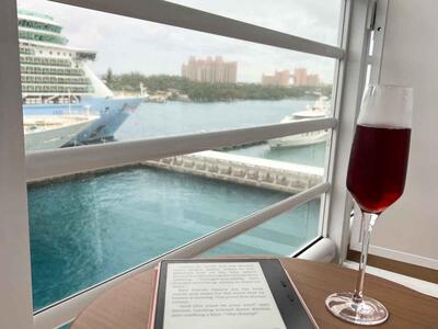 eReader and drink on table on cruise balcony