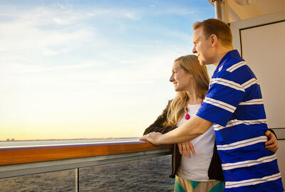 Couple enjoying their cruise ship balcony