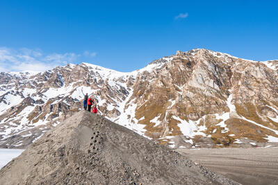 Man posing on a hill in Svalbard