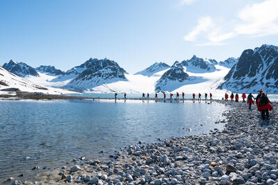 Group of hikers trekking through Svalbard