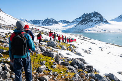 Group of hikers trekking through Svalbard