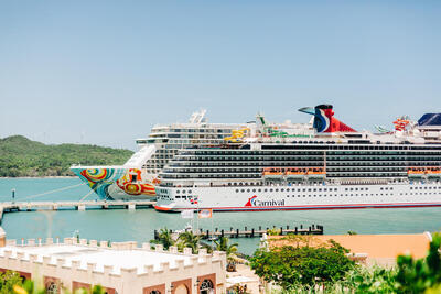 NCL and Carnival ship docked together