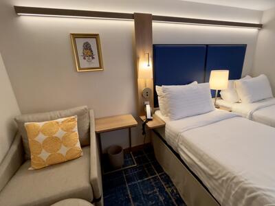 Beds in an inside cabin on Icon of the Seas