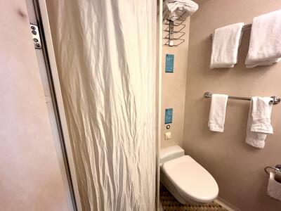 Cloth shower curtain in bathroom