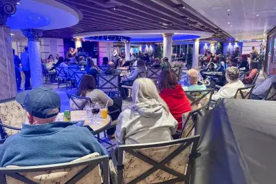 passengers watching karaoke on a Carnival cruise