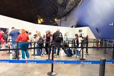 cruise passengers standing in the Long Beach cruise terminal