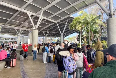 Passengers outside Carnival cruise terminal in Long Beach California