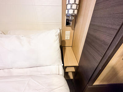 outlet next to bed in cruise cabin