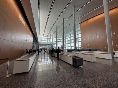 Rows of cruise terminal security counters and screening machines