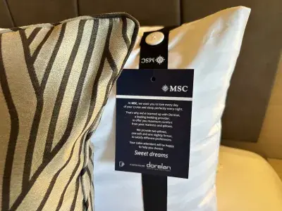 A sign telling cruisers about pillow options in their cabin