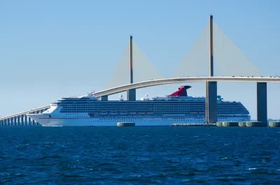 Carnival ship passing under Tampa bridge