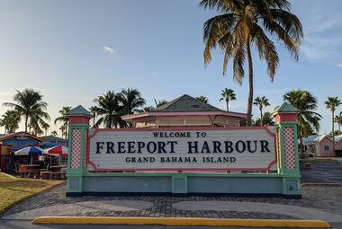 Welcome to Freeport Bahamas sign with palm tree