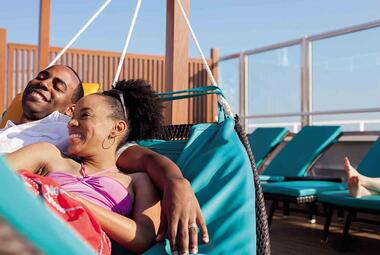 Couple enjoying time on a Carnival cruise in adults only area