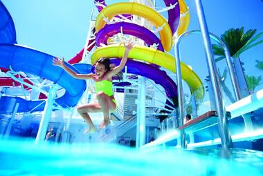 Kid jumping in pool on NCL cruise ship