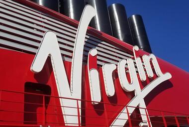Virgin Voyages logo on ship